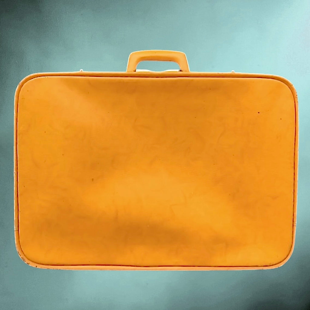 Valise vintage orange en Skaï années 60 – valise rétro avec doublure satinée