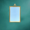 Miroir mural vintage en laiton doré à fronton feuille