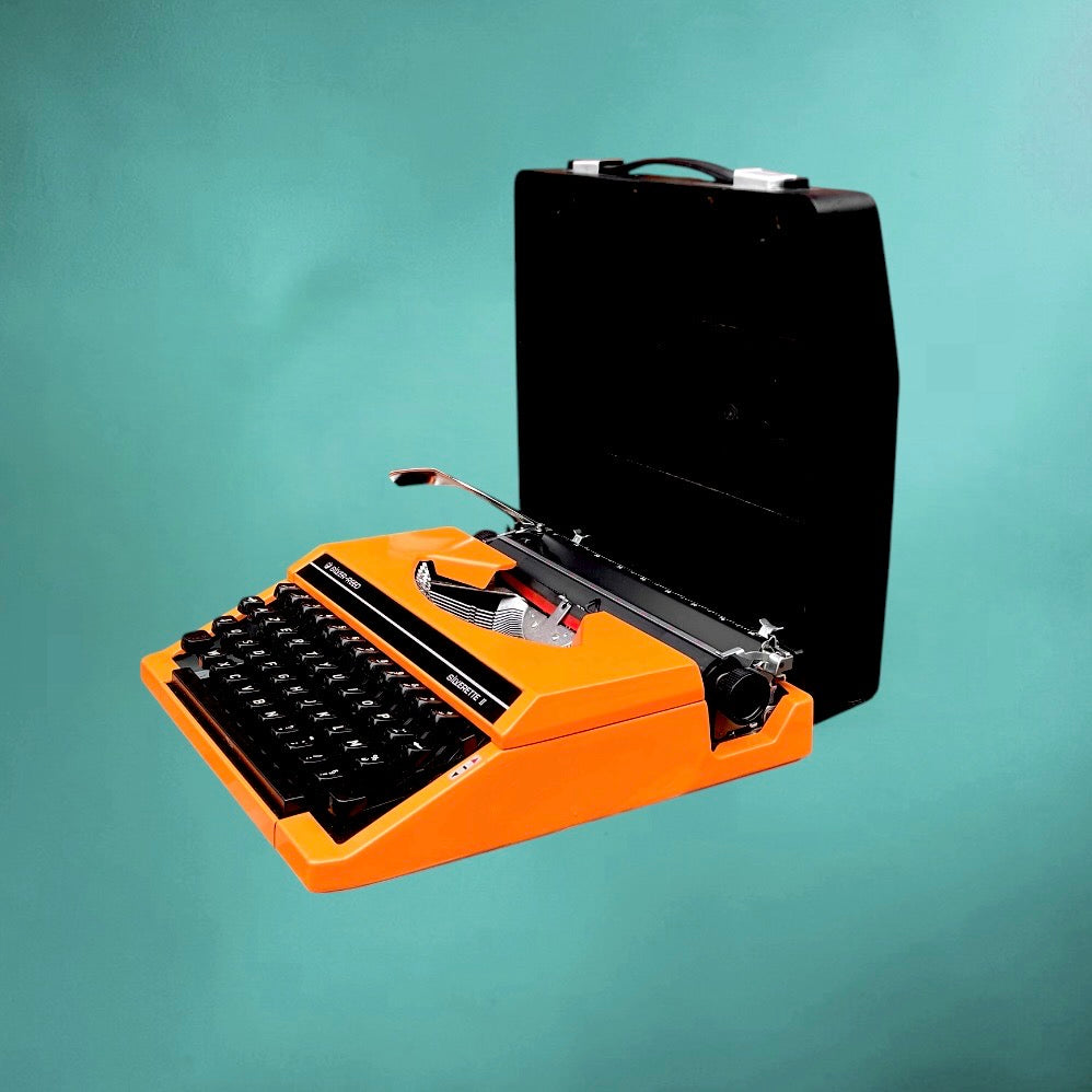 machine a ecrire silver reed orange vintage avec valise
