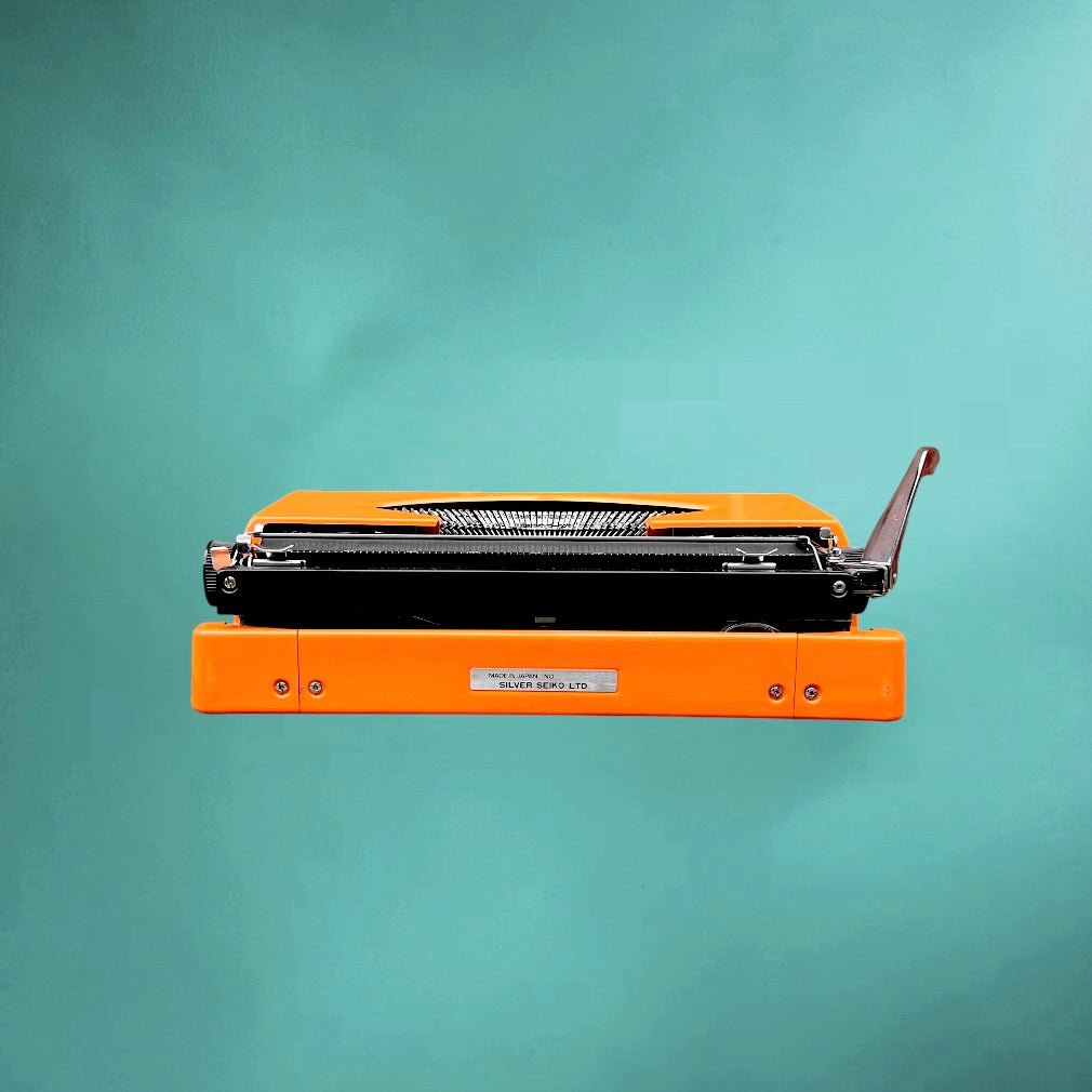 Machine a écrire vintage Silver Reed Silverette II orange-  Japon portable avec valise -  années 70 80