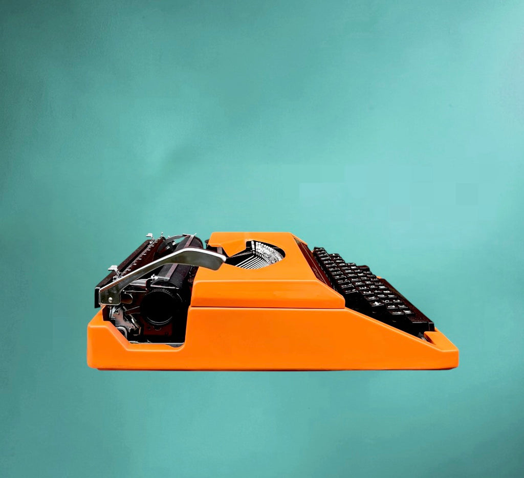 Machine a écrire vintage Silver Reed Silverette II orange-  Japon portable avec valise -  années 70 80