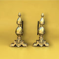 Paire de chenets anciens en laiton et fonte – style Louis XVI – décor pomme de pin