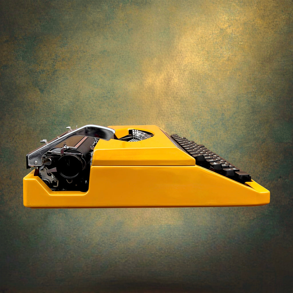 Machine à Écrire Sperry Remington 1050 Jaune Ocre AZERTY avec Valise – Années 70